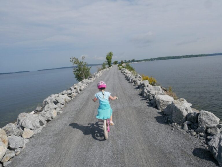 Girl riding her bike on the island line bike trail