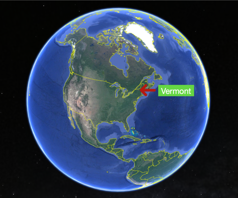 Picture of the globe pointing to where Vermont is