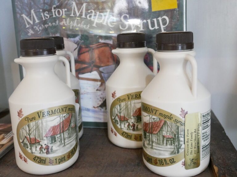 vermont maple syrup bottles in front of a book that says m is for maple syrup
